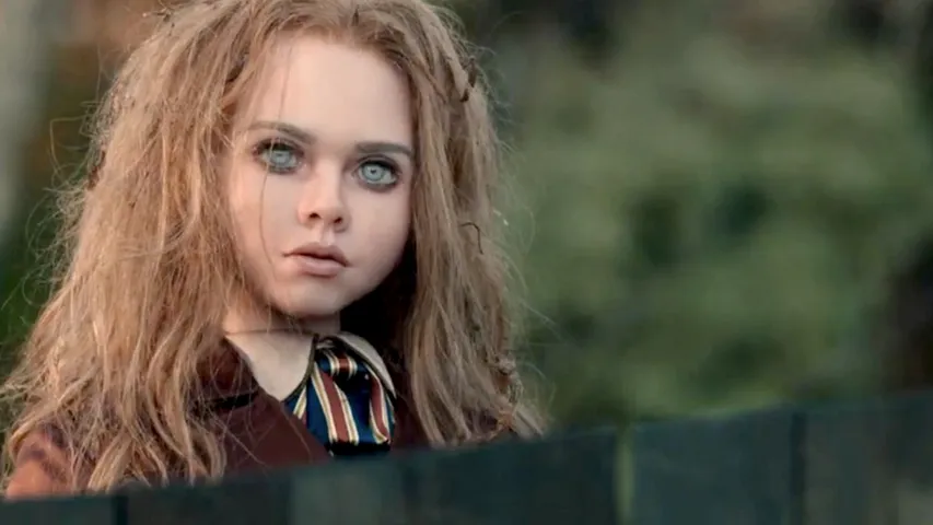 325513-megan-movie-review M3GAN Returns to Theaters — And This Time, She’s Watching You at Home.